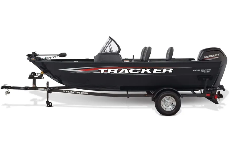 Slide: The Image of 2026 Tracker Pro Guide V-16 WT boat dashboard with steering wheel and gauges. - 6