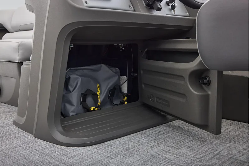 Slide: The Image of 2026 Sun Tracker SportFish 22 DLX interior with seating and storage area. - 34