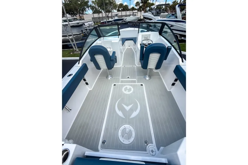 Slide: The Image of 2024 Aquasport AS DC 22 boat interior with blue seating and sleek design. - 5