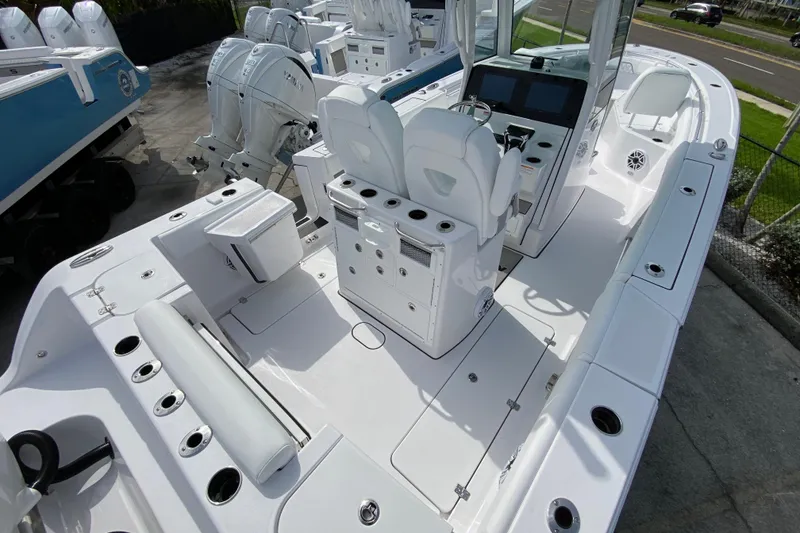 Slide: The Image of 2026 Sportsman Open 262 Center Console boat with dual seats and Yamaha engines. - 13