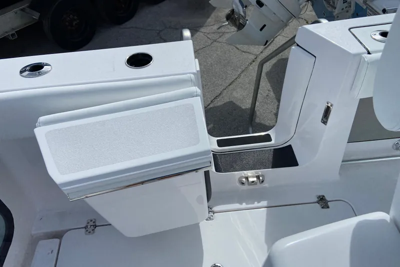 Slide: The Image of 2026 Sportsman Open 262 Center Console boat interior with seating and storage compartments. - 18