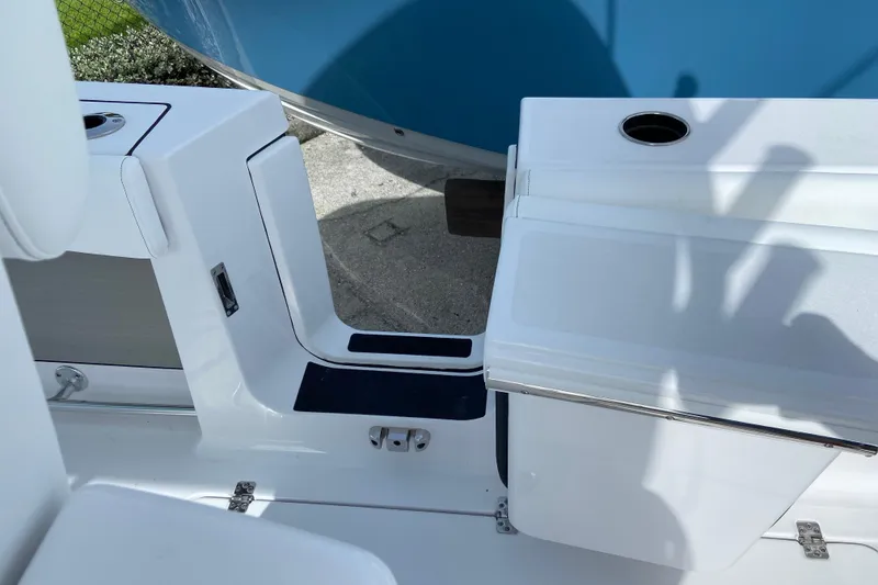 Slide: The Image of 2026 Sportsman Open 262 Center Console boat interior with seating and storage compartments. - 20