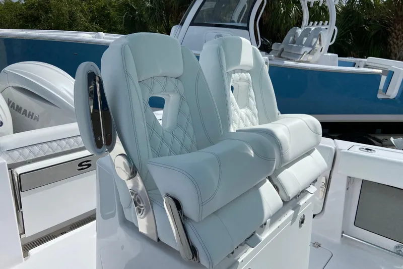 Slide: The Image of 2026 Sportsman Open 262 Center Console boat with luxurious seating and Yamaha engine. - 25