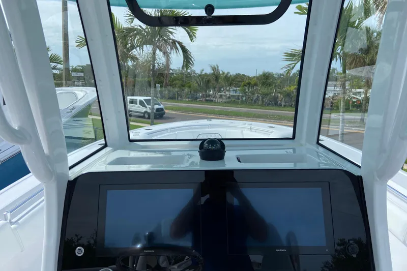 Slide: The Image of 2026 Sportsman Open 262 Center Console dashboard with dual screens and compass. - 28