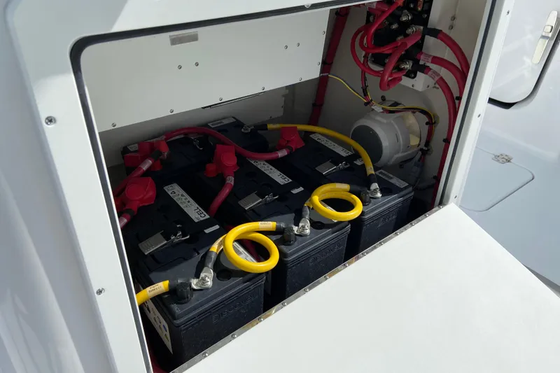 Slide: The Image of Battery compartment of 2026 Sportsman Open 262 Center Console boat with wiring. - 35