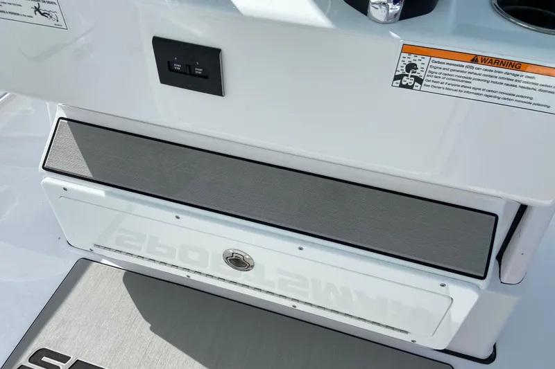 Slide: The Image of 2026 Sportsman Open 262 Center Console dashboard with warning label and controls. - 36