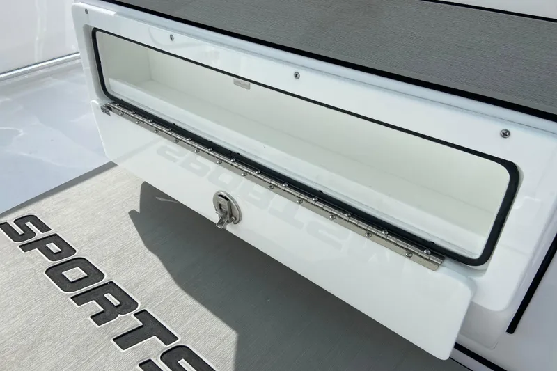 Slide: The Image of Open storage compartment on 2026 Sportsman Open 262 Center Console boat. - 37