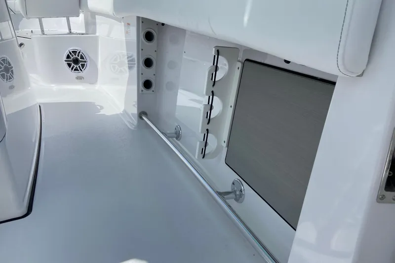 Slide: The Image of 2026 Sportsman Open 262 Center Console interior with speakers and storage compartments. - 38