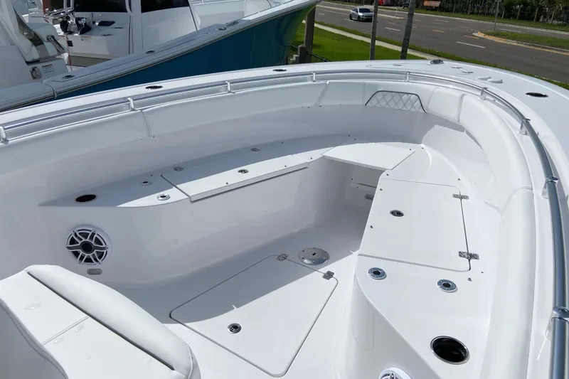 Slide: The Image of 2026 Sportsman Open 262 Center Console boat interior with seating and storage compartments. - 40