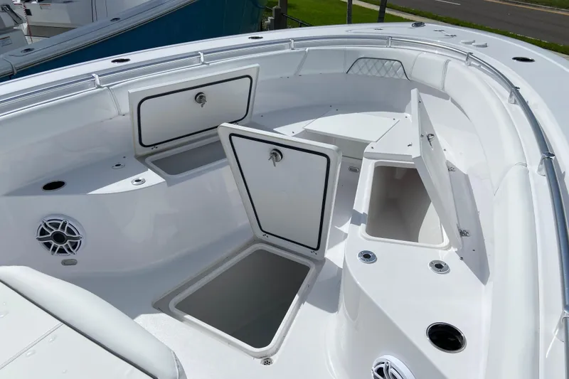 Slide: The Image of 2026 Sportsman Open 262 Center Console boat with open storage compartments. - 41