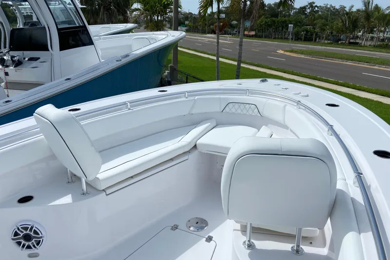 Slide: The Image of 2026 Sportsman Open 262 Center Console boat with white seating and sleek design. - 42