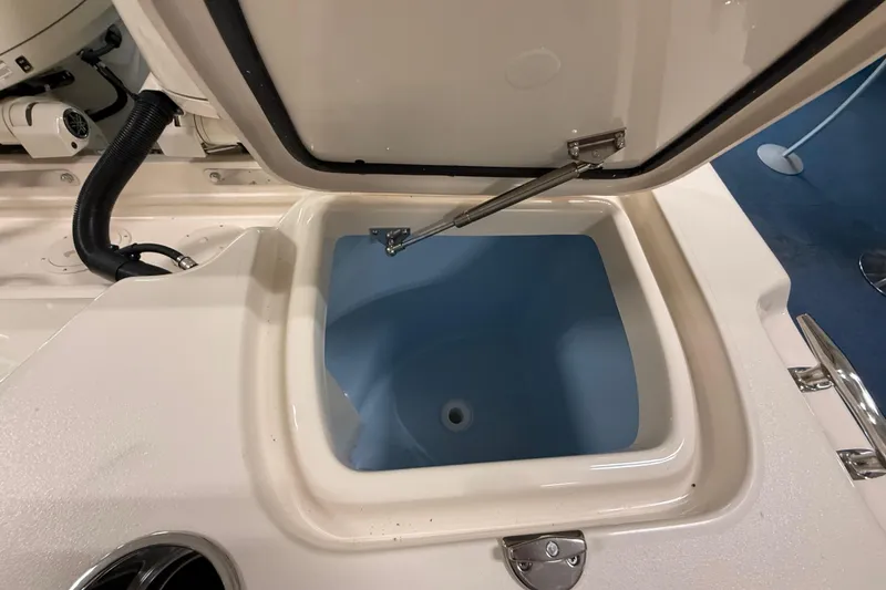 Slide: The Image of Open storage compartment on 2026 Grady-White Freedom 255 boat, showcasing interior design. - 14