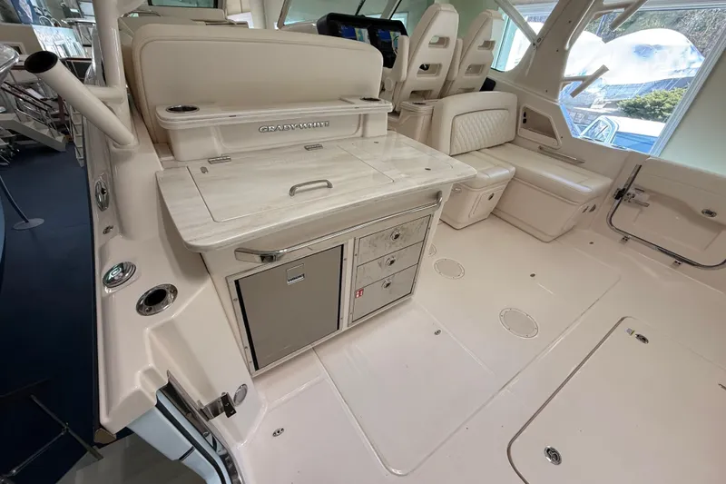 Slide: The Image of 2026 Grady-White Freedom 345 boat interior with seating and storage features. - 13