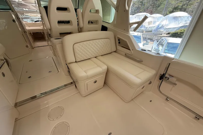 Slide: The Image of Luxurious interior of 2026 Grady-White Freedom 345 boat with plush seating. - 14