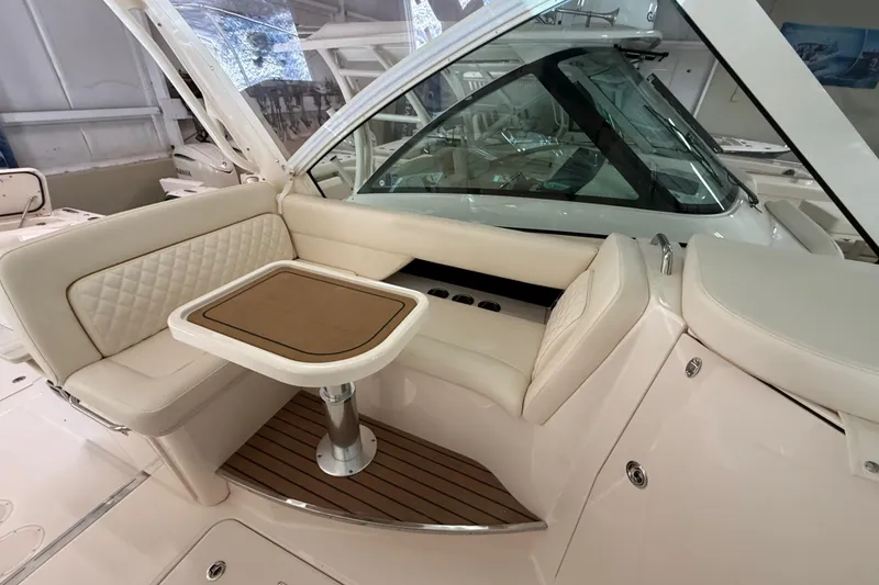 Slide: The Image of Luxurious seating area on 2026 Grady-White Freedom 345 boat with elegant table. - 17
