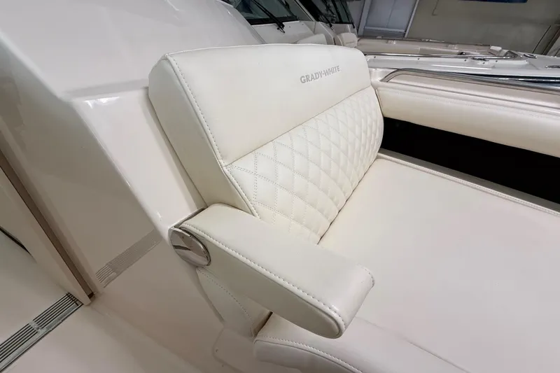 Slide: The Image of Luxurious seating on 2026 Grady-White Freedom 345 boat, featuring elegant white upholstery. - 21