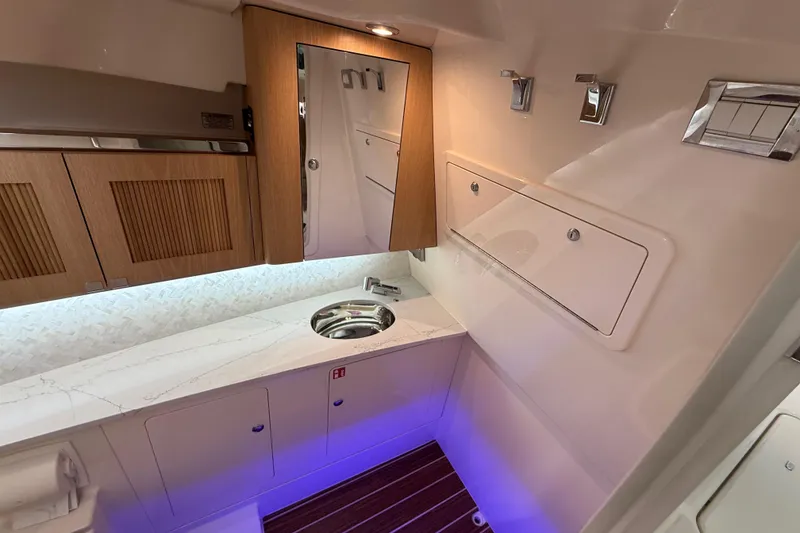 Slide: The Image of Luxurious interior of 2026 Grady-White Freedom 345 boat with modern amenities. - 24