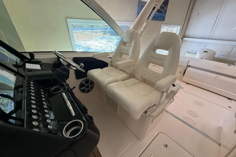 Slide: The Image of Interior of 2026 Grady-White Freedom 345 boat with luxurious seating and modern controls. - 25
