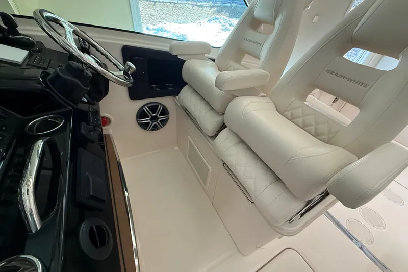 Slide: The Image of Luxury interior of 2026 Grady-White Freedom 345 boat with plush seating and modern controls. - 26