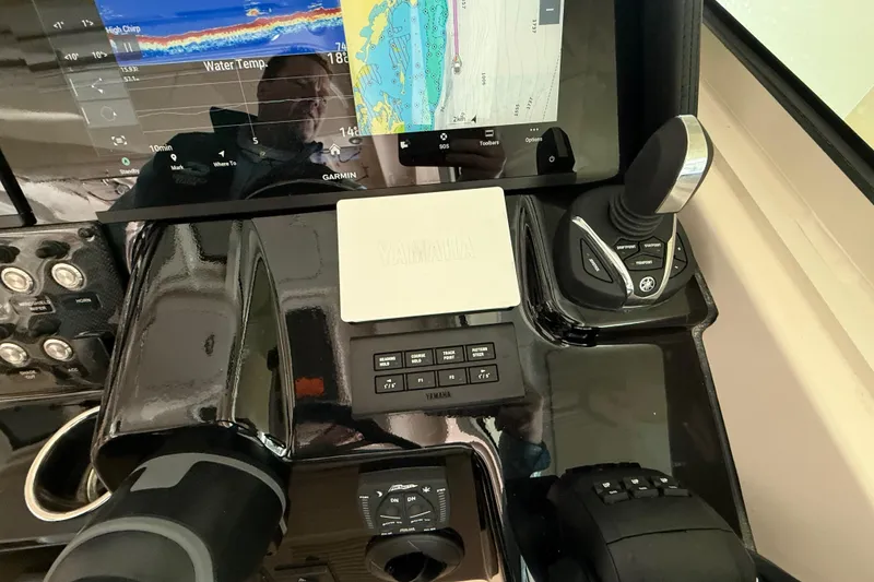Slide: The Image of 2026 Grady-White Freedom 345 helm with Garmin navigation and Yamaha controls. - 29