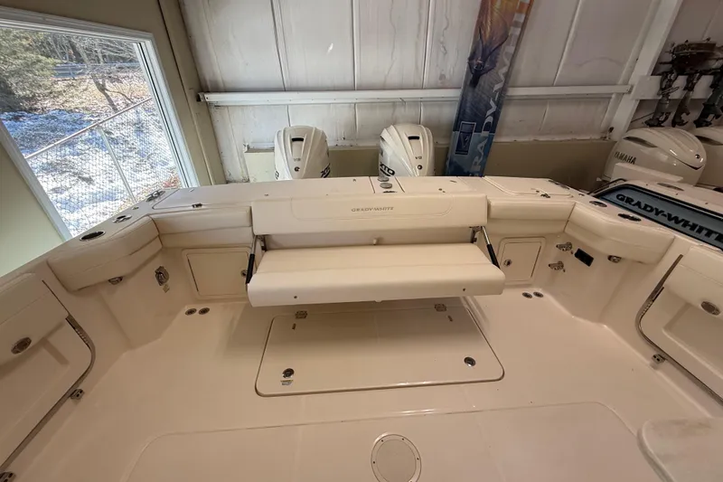 Slide: The Image of 2026 Grady-White Freedom 345 boat interior with seating and storage compartments. - 32