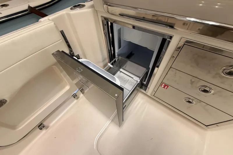Slide: The Image of 2026 Grady-White Freedom 345 boat interior with open stainless steel drawer. - 34