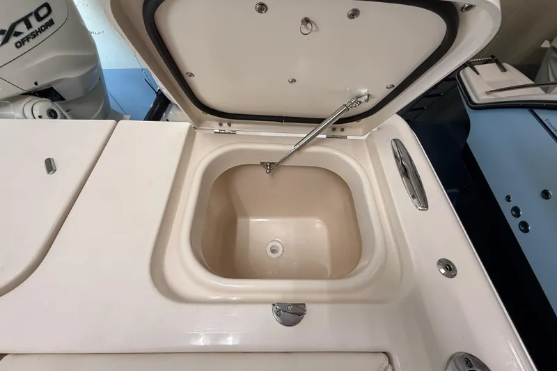 Slide: The Image of Open storage compartment on 2026 Grady-White Freedom 345 boat deck. - 36
