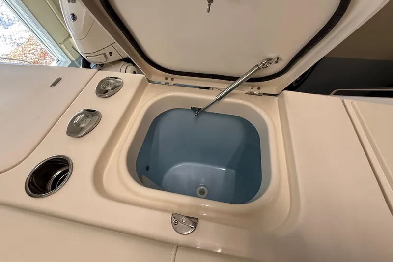 Slide: The Image of Open storage compartment on 2026 Grady-White Freedom 345 boat. - 37