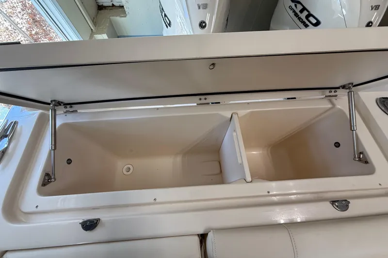 Slide: The Image of Open storage compartment on 2026 Grady-White Freedom 345 boat, showcasing spacious interior. - 38