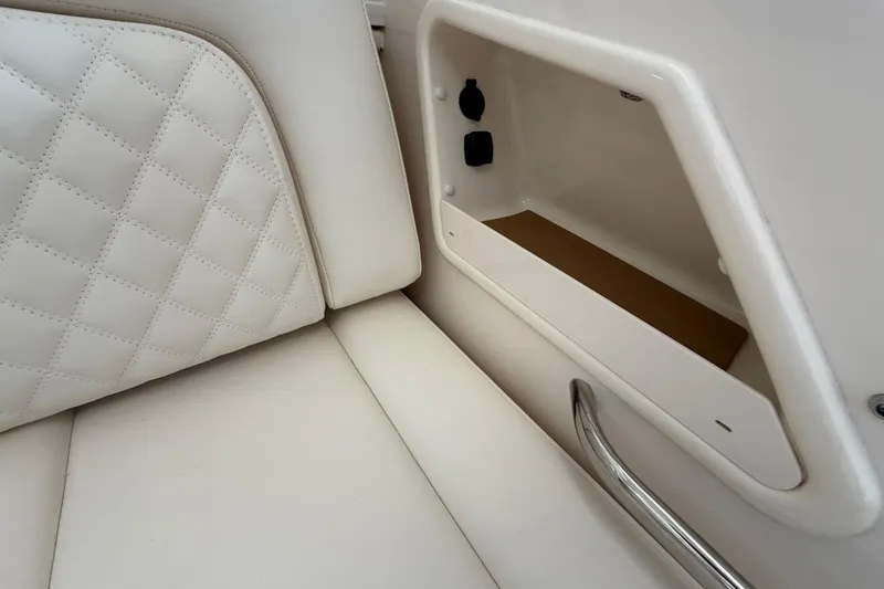 Slide: The Image of 2026 Grady-White Freedom 345 interior with quilted seating and storage compartment. - 41