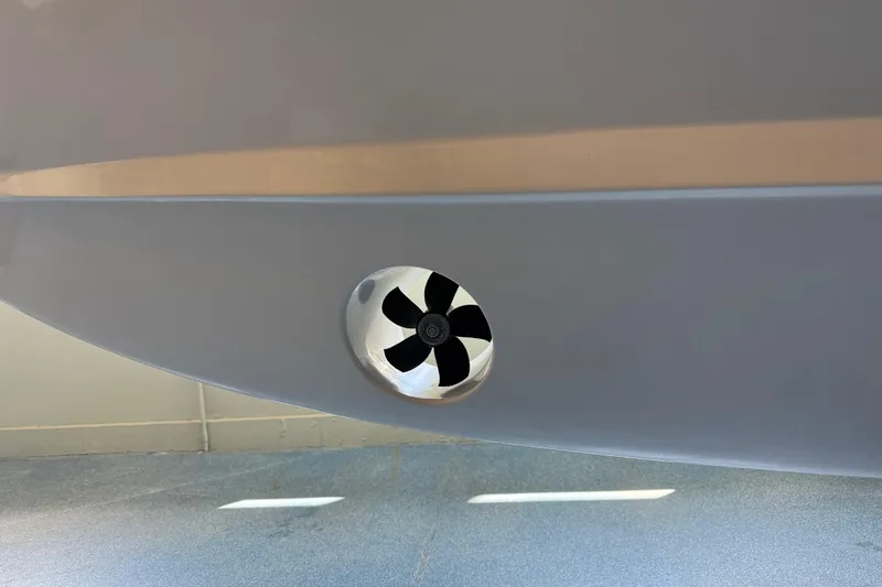 Slide: The Image of Close-up of a 2026 Grady-White Freedom 345 boat's hull with a visible thruster. - 43