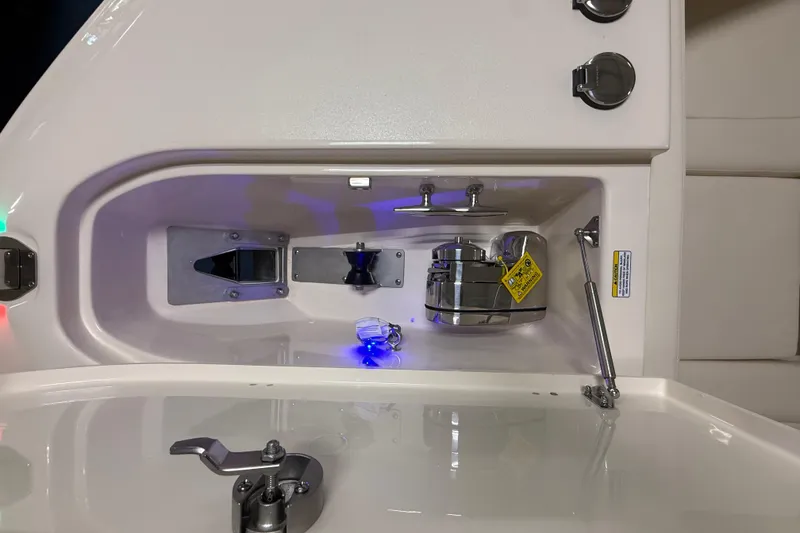 Slide: The Image of 2026 Grady-White Canyon 306 boat interior with anchor storage and control panel. - 13