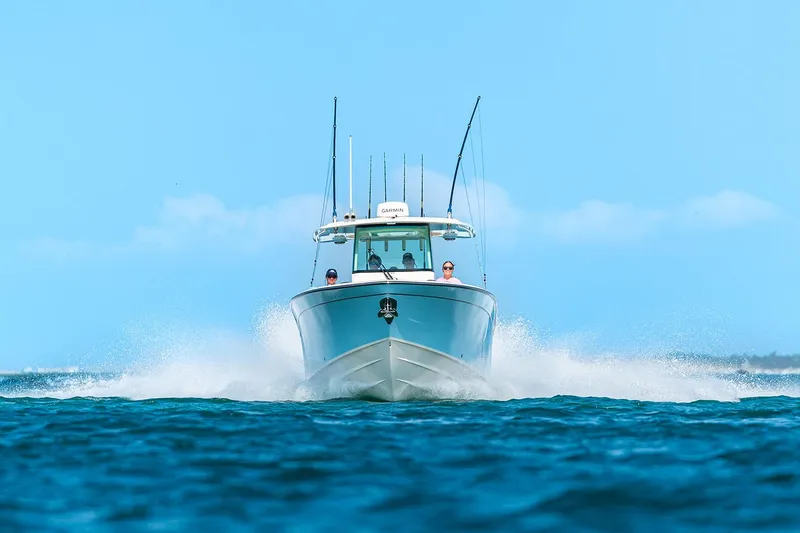 Slide: The Image of Manufacturer Provided Image: 2025 Grady-White Canyon 306 boat cruising on open water, front view. - 28