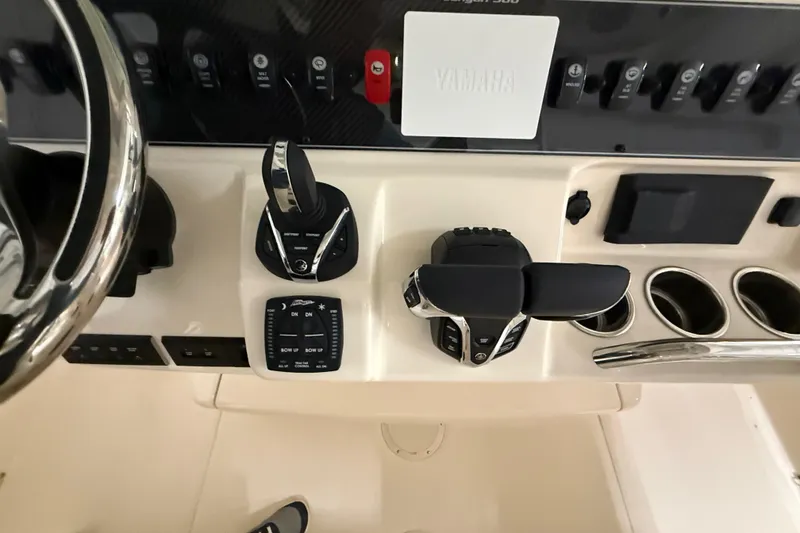 Slide: The Image of Control panel of 2026 Grady-White Canyon 306 boat with Yamaha throttle and switches. - 38