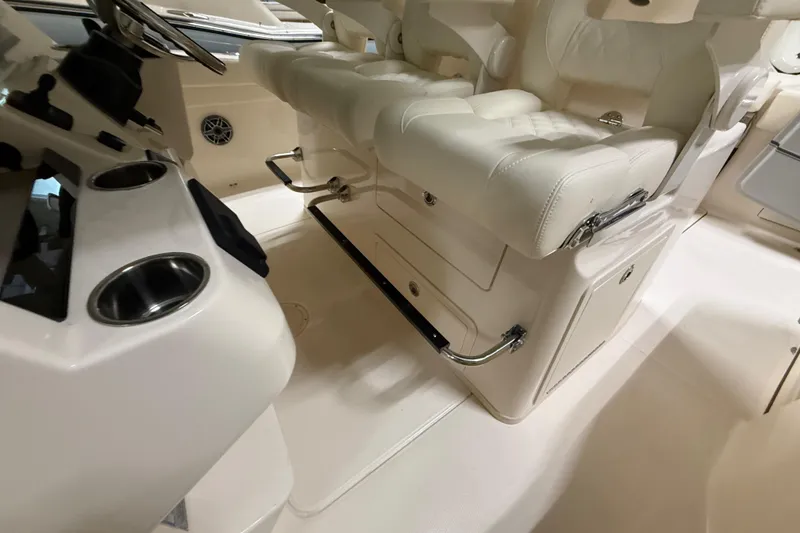Slide: The Image of Luxurious interior of 2026 Grady-White Canyon 326 boat with plush seating and cup holders. - 10