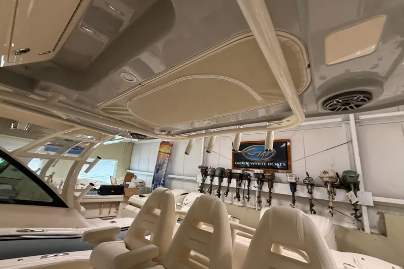 Slide: The Image of 2026 Grady-White Canyon 326 boat interior with luxury seating and modern design. - 14