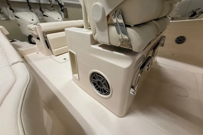 Slide: The Image of 2026 Grady-White Canyon 326 boat interior with seating and speaker detail. - 19