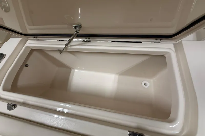 Slide: The Image of Open storage compartment on 2026 Grady-White Canyon 326 boat, showcasing spacious interior. - 22