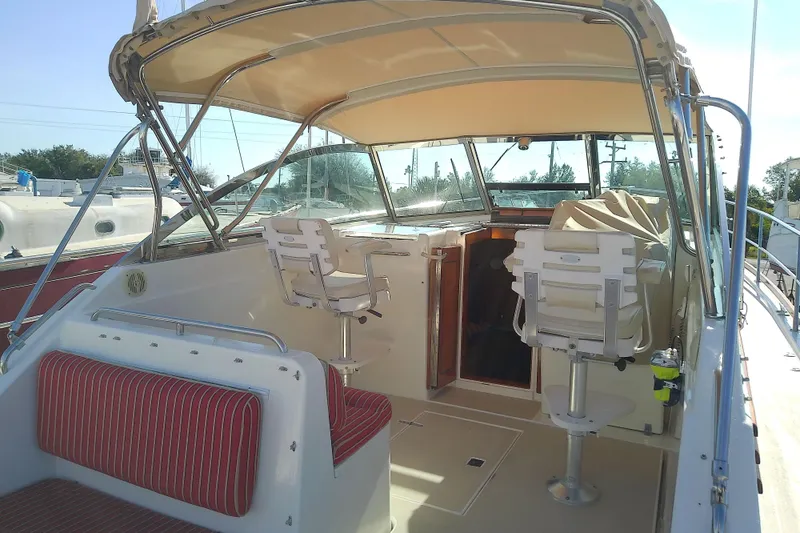 Slide: The Image of 2002 Sabreline 36 Express boat interior with seating and helm station. - 10