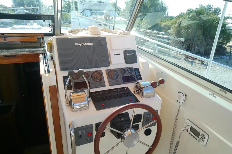 Slide: The Image of Helm of 2002 Sabreline 36 Express boat with navigation equipment and controls. - 27