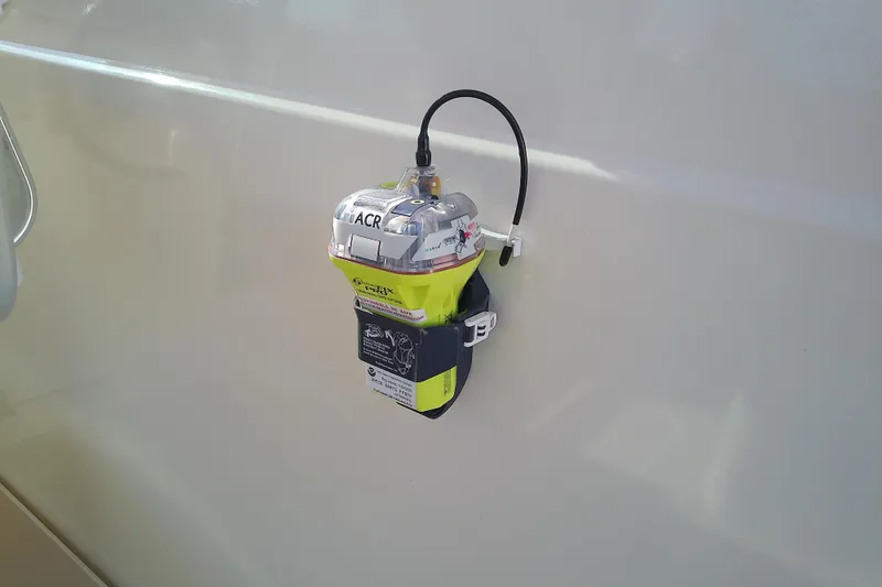 Slide: The Image of Emergency beacon mounted on 2002 Sabreline 36 Express boat exterior. - 32