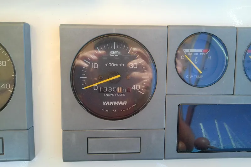 Slide: The Image of Yanmar engine gauges on 2002 Sabreline 36 Express, showing 1335 engine hours. - 36