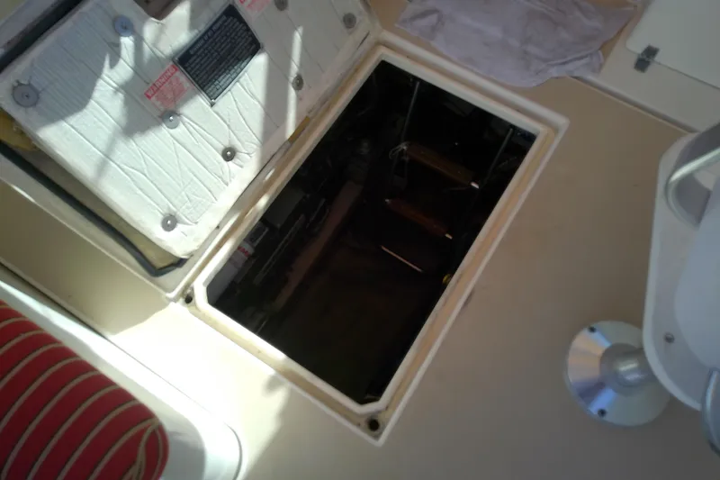 Slide: The Image of 2002 Sabreline 36 Express engine compartment with open hatch, revealing interior components. - 37