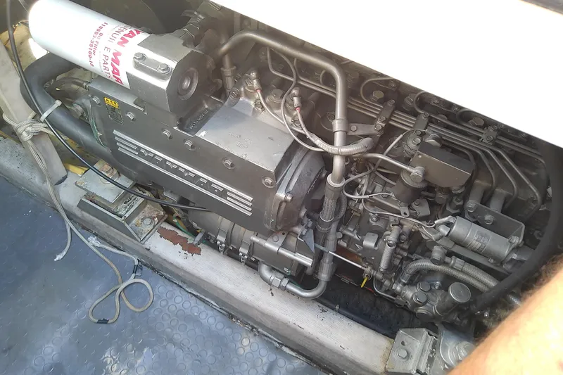 Slide: The Image of Engine compartment of a 2002 Sabreline 36 Express boat, showcasing mechanical components. - 81