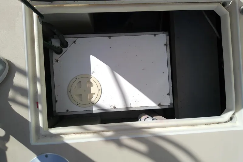 Slide: The Image of Engine compartment of 2002 Sabreline 36 Express boat, showing mechanical components. - 85