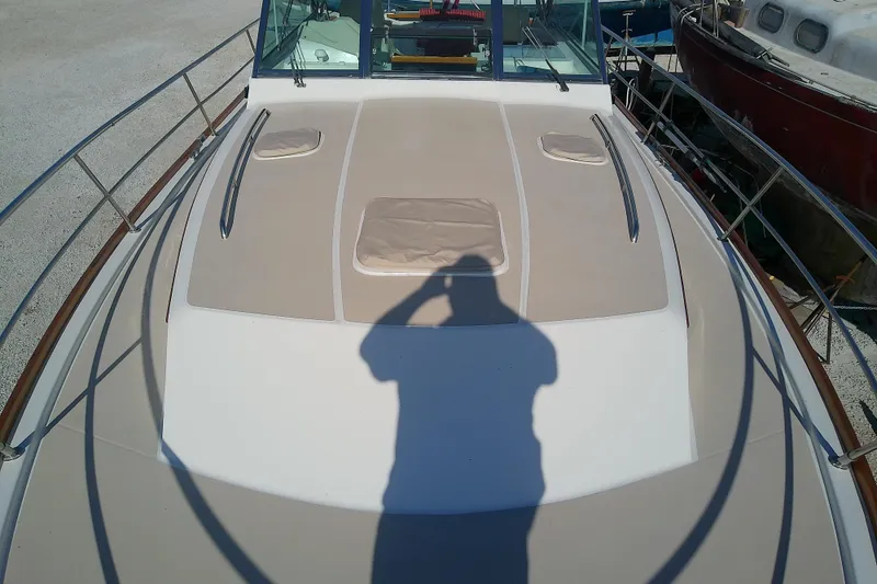 Slide: The Image of 2002 Sabreline 36 Express boat deck with shadow and railing. - 15