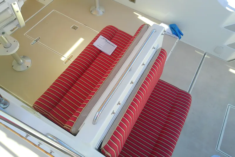 Slide: The Image of Red-striped seating on 2002 Sabreline 36 Express boat deck. - 22