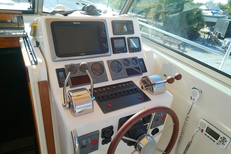 Slide: The Image of Helm of 2002 Sabreline 36 Express boat with navigation equipment and controls. - 28