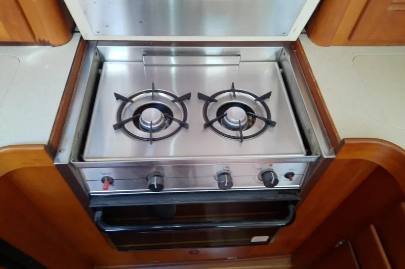 Slide: The Image of Stainless steel stove in 2002 Sabreline 36 Express yacht kitchen. - 63