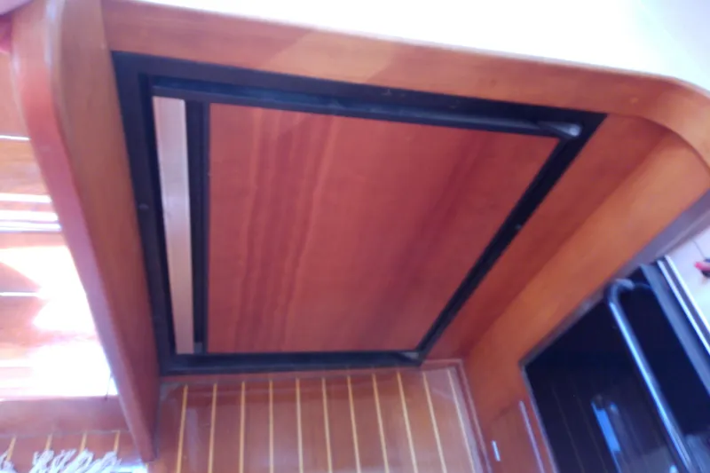 Slide: The Image of 2002 Sabreline 36 Express interior ceiling with wooden finish and sleek design. - 64